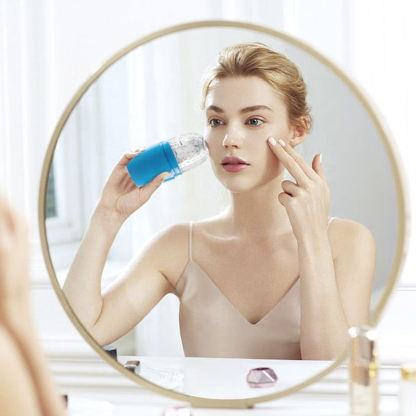 Woman applying skincare product in front of a mirror